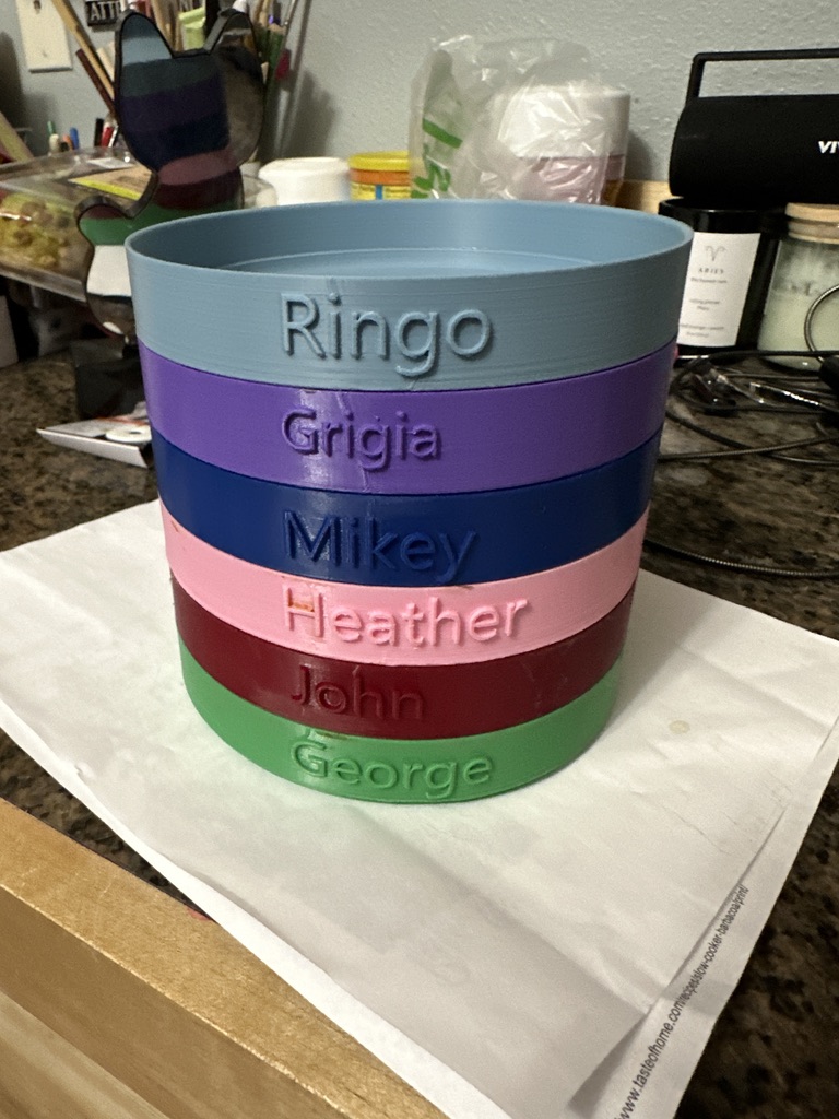 7 small PLA printed cat's bowls with cat's names embossed