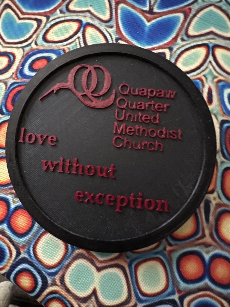 Drink Coaster 3d print in PLA with writing embossed in black and red